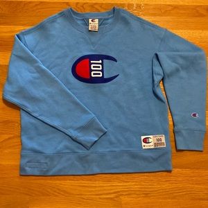 Woman’s Champion 100 light blue Crewneck Sweater